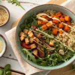 Vibrant grain bowl with quinoa, roasted vegetables, and tahini