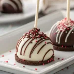 Oreo cake pops drizzled with chocolate and sprinkles