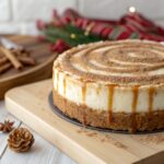 Close‑up view of churro cheesecake with cinnamon sugar crust and caramel drizzle