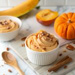 Creamy pumpkin nice cream in bowl made with frozen bananas showing smooth soft-serve texture